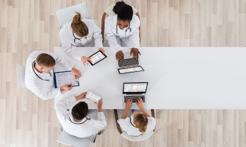 medical personnel at a table