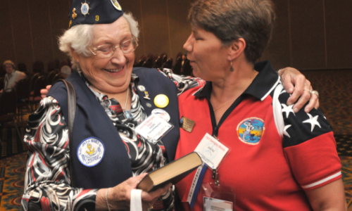 Two female veterans laugh together